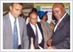 His Excellency Prof. Gilbert Bukenya, the Ugandan Vice President lights the lamp at Mehta Group pavilion during the International Trade Fair