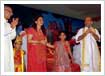 Bhagwat Saptah held in Porbandar in memory of Savitadidi Mehta. Seen here (from l-r) are Jay, Arjun and Juhi Mehta and Pujyashree Bhupendrabhai Pandya 